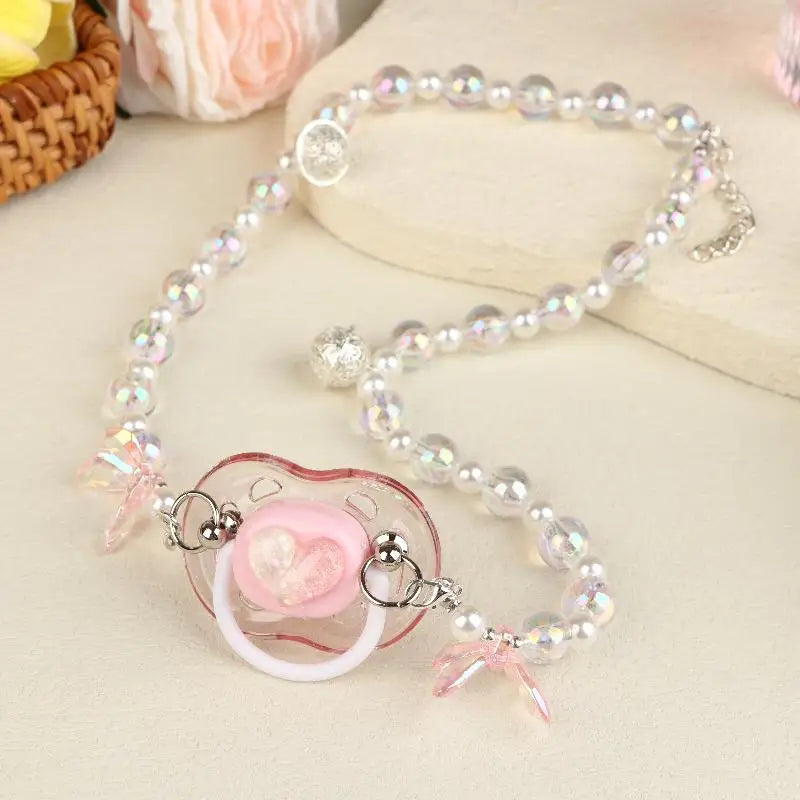 Kawaii rainbow candy pacifier clip with heart and bell ribbon, ideal for soft girl DDLG ABDL vibes