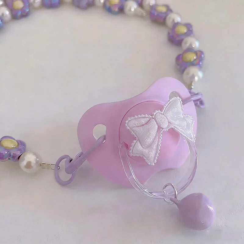 Little Baby Bloom Bell Pacifier with ribbon accent, pastel kawaii/DDLG aesthetic