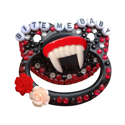 Detail shot of dense rhinestone embellishments covering the black pacifier shield