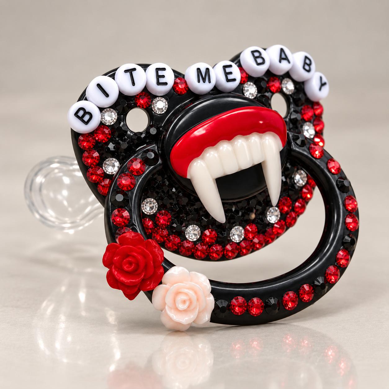 Side angle view of glossy black gothic pacifier showing full rhinestone design