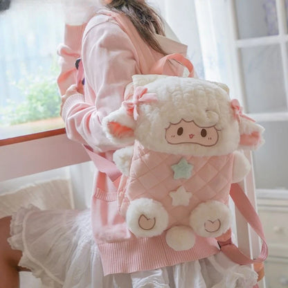 Close up of pastel mint green and off white star details on lamb plush backpack