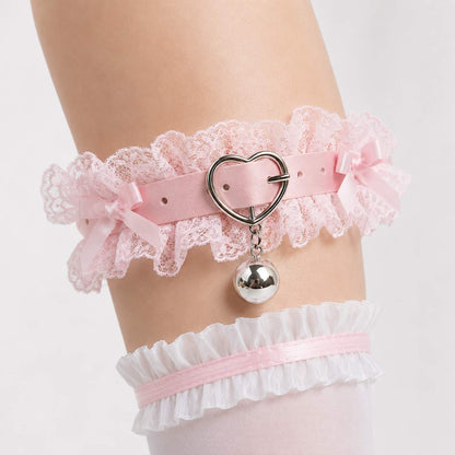 Little Love Bell Coquette Garter in soft pastel pink with heart charm and satin bow, front view