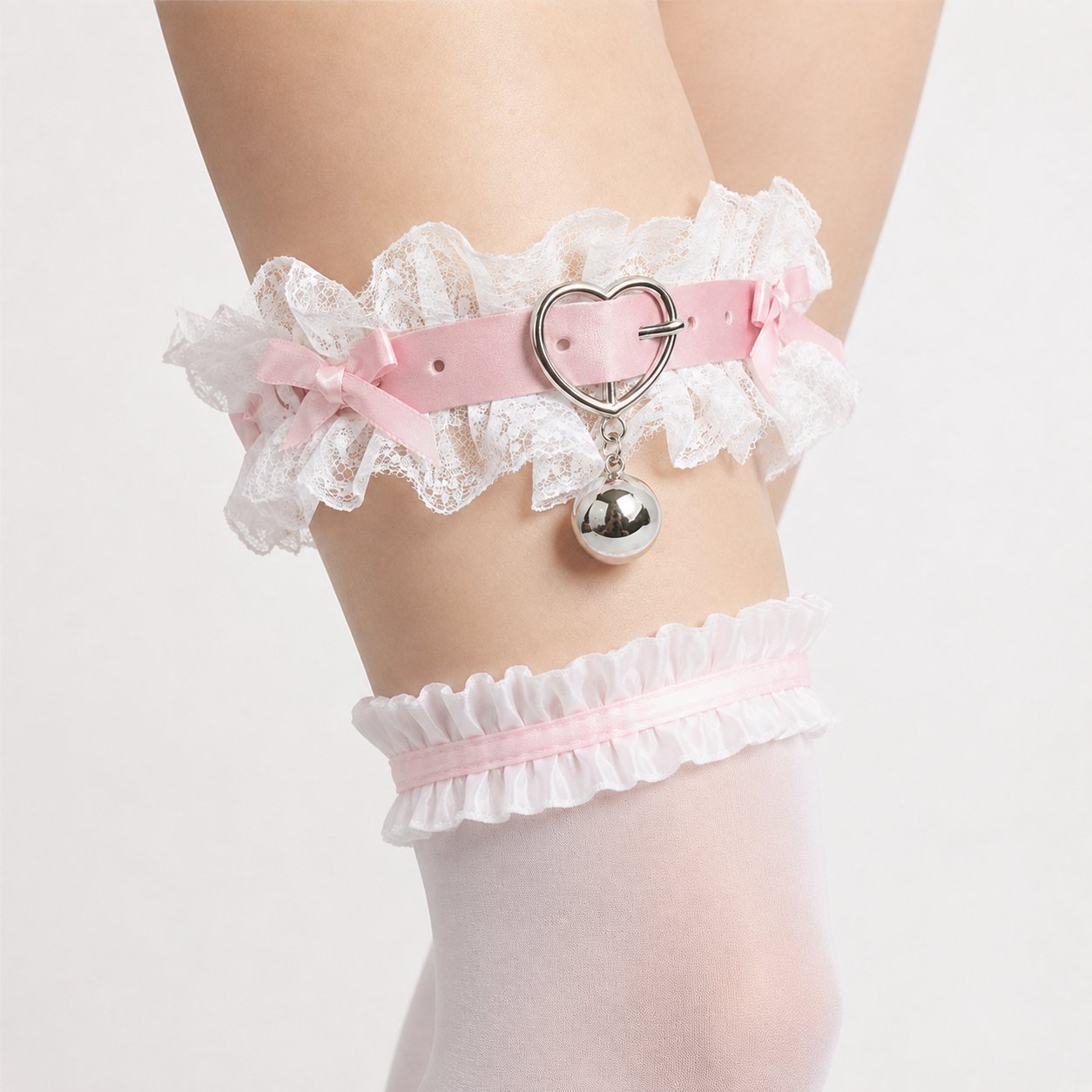 Close up of dainty satin bow and ruffled floral lace on kawaii coquette garter
