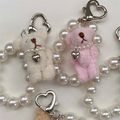 Close-up of Lolita Mini Animal Keychains, cute detailed charms, pastel kawaii aesthetic, ABDL & cutebaddie collectible accessory