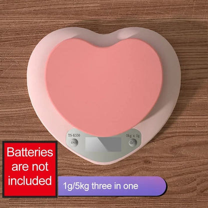 Pink heart-shaped digital kitchen scale with LCD screen and 5kg capacity for baking and cooking precision