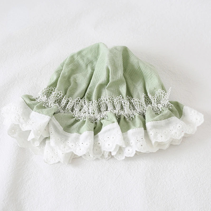 Mint green lace bonnet styled for fairycore and Lolita fashion