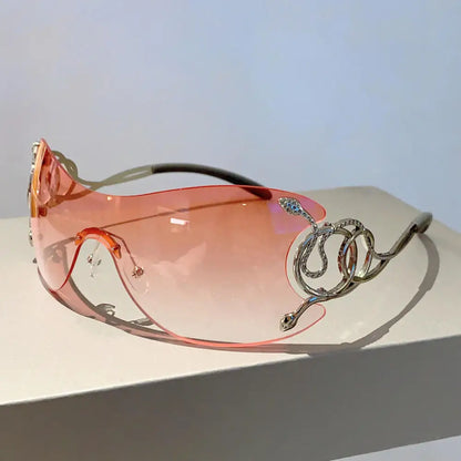 Mob Wife Donna Shades vibrant pink, lightweight rimless frames with magical crescent moon accents