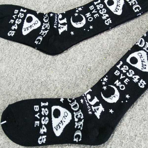 Mystical goth black and white Ouija stockings featuring occult prints and dark cutecore aesthetics
