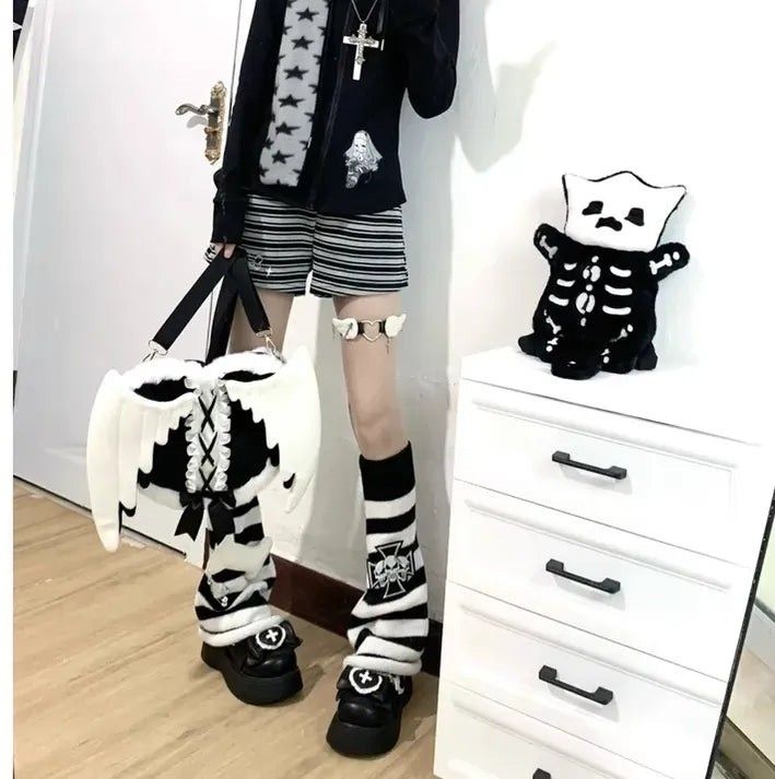 Pastel goth lolita angel wings plush backpack in black & white for soft goth, angelcore, and kawaii outfits