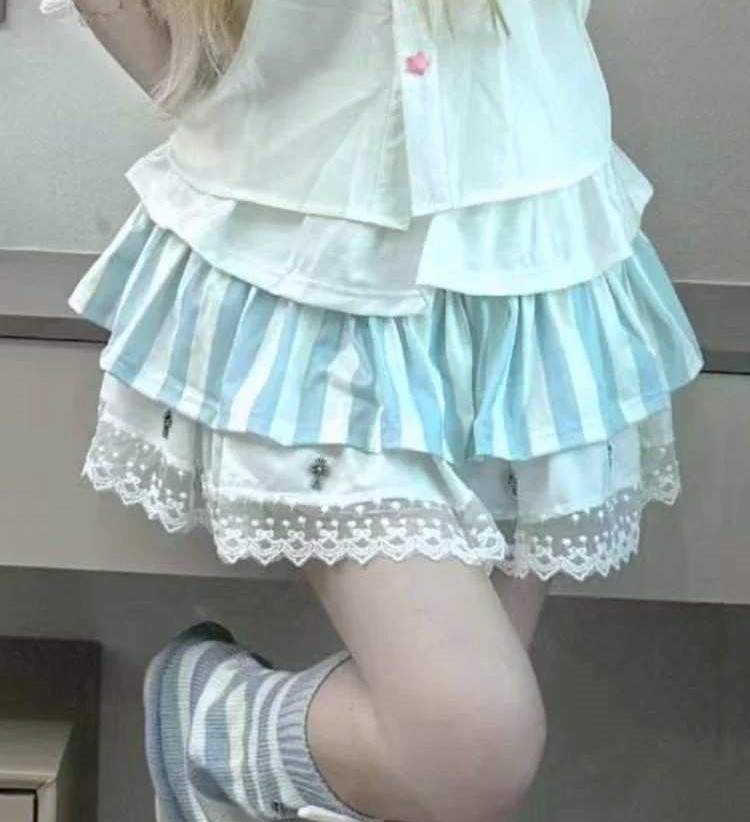 Pastel gothic lolita skirt with soft layered frills and delicate cross appliqués for kawaii DDLG and soft goth outfits