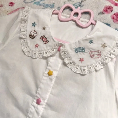 Pastel kawaii babydoll blouse featuring adorable baked goods and treats print
