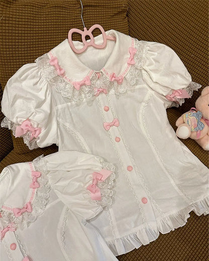 Soft pastel Lolita blouse with Peter Pan collar and delicate feminine accents