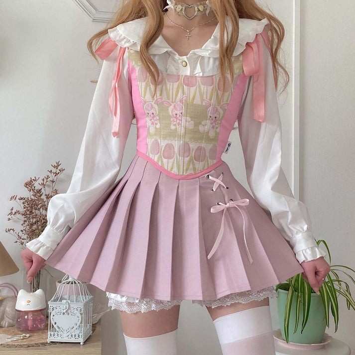 Pastel pink Dollcore Lolita pleated skirt with lace accents for kawaii, cutecore, soft girl, DDLG, and ABDL outfits
