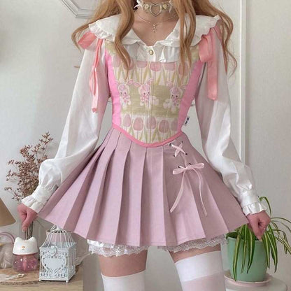 Pastel pink Dollcore Lolita pleated skirt with lace accents for kawaii, cutecore, soft girl, DDLG, and ABDL outfits