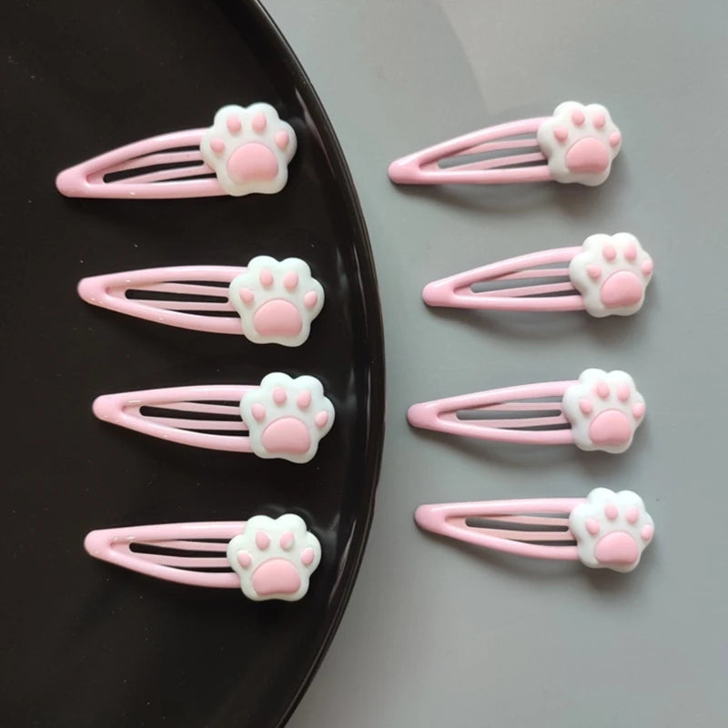 Pastel pink paw hair clips featuring plush design, perfect for kawaii and DDLG outfits