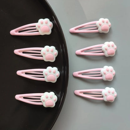 Pastel pink paw hair clips featuring plush design, perfect for kawaii and DDLG outfits
