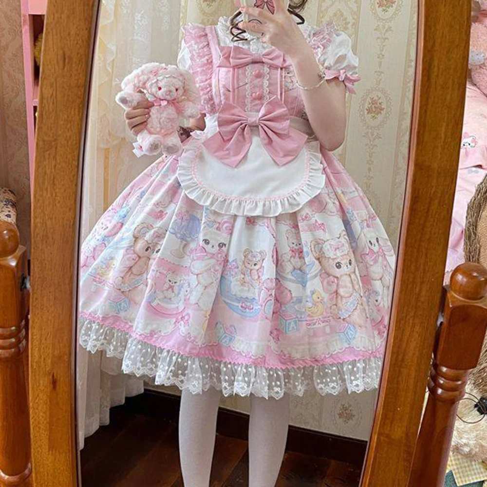 Detachable white apron with frilled edging and oversized pink bow on Sweet Lolita teddy bear dress