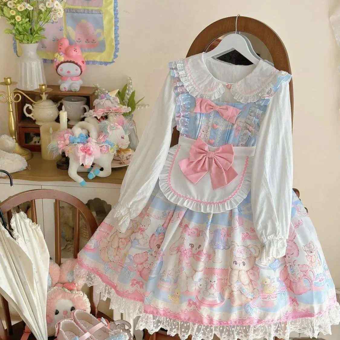 Multi tiered white lace hem with Swiss dot detailing on pastel Sweet Lolita teddy bear dress