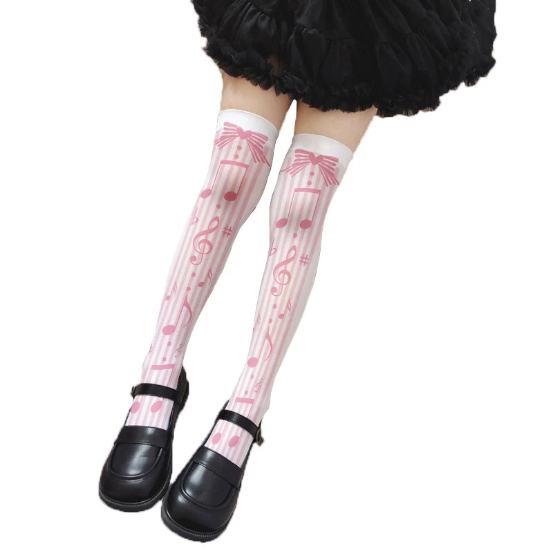 Pastel pink sweet melody note stockings with ribbon hearts and music notes for kawaii cutecore vibes