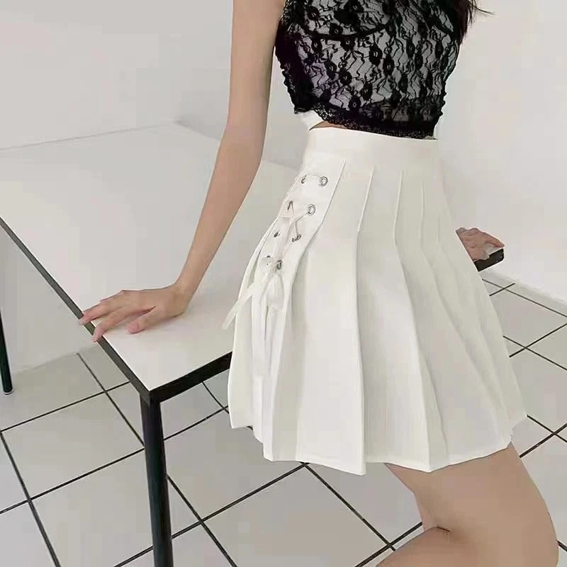 Pastel white Dollcore Lolita pleated skirt with frilly lace trim for kawaii, cutecore, soft girl, DDLG, and ABDL fashion