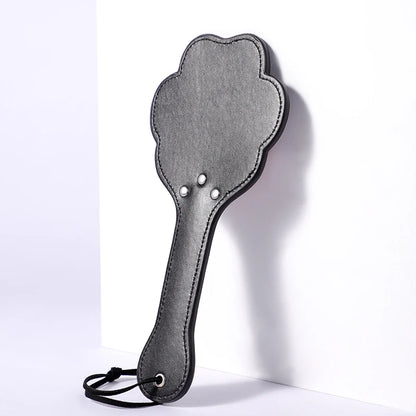 Bold red and black paw paddle for kinky roleplay and playful cutecore fun