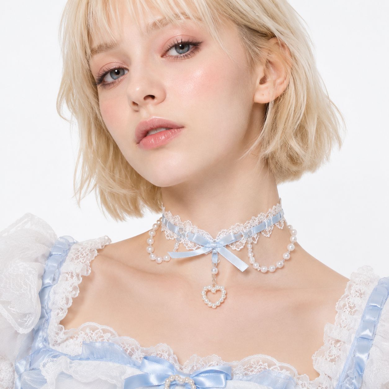 Pearl Heart Coquette Lace Choker in pastel blue with satin bow and pearl strands, front view