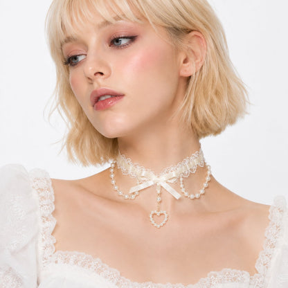 Pearl Heart Coquette Lace Choker in cream beige with floral lace and pearl heart charm