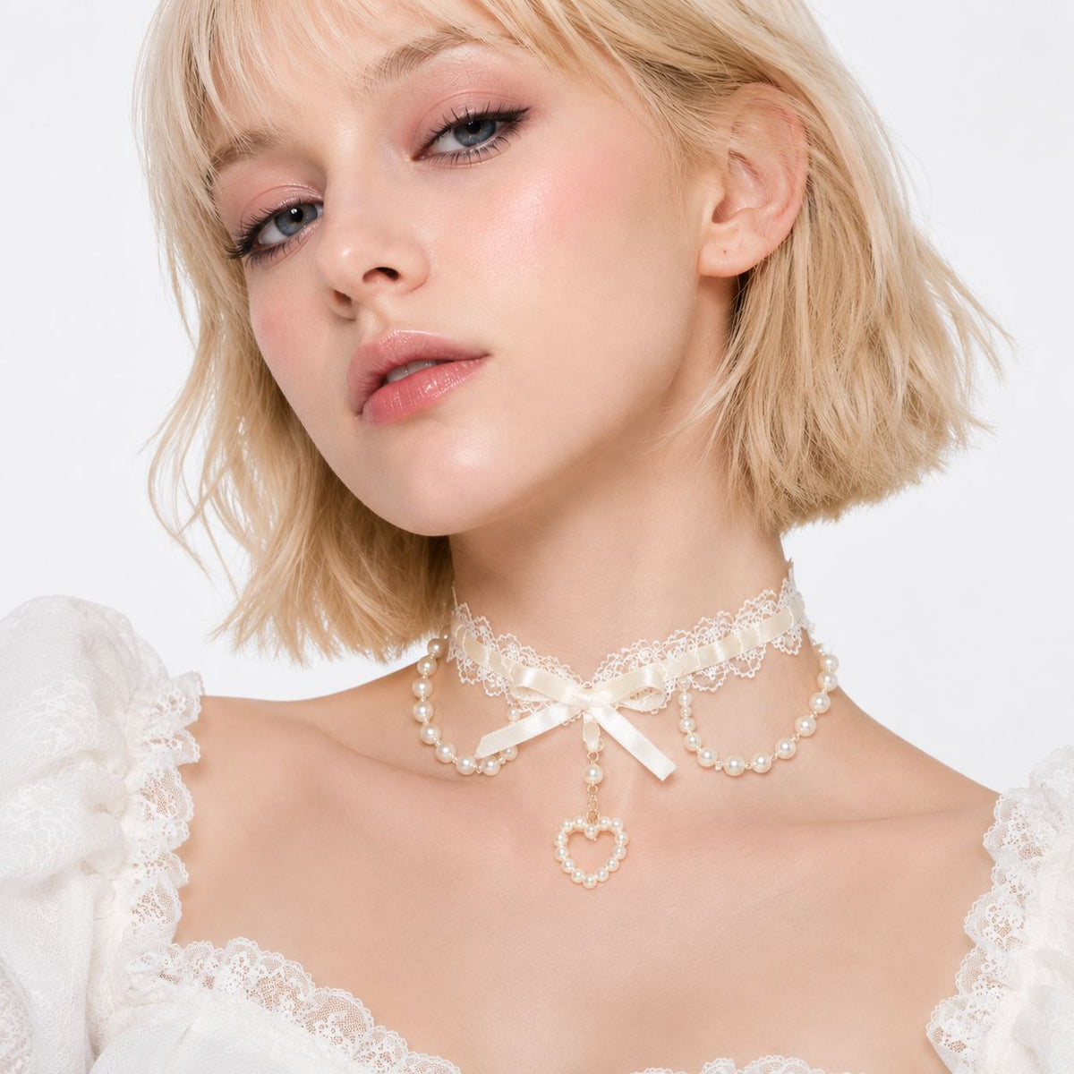 Close up of scalloped floral lace edging on cream beige coquette lace choker