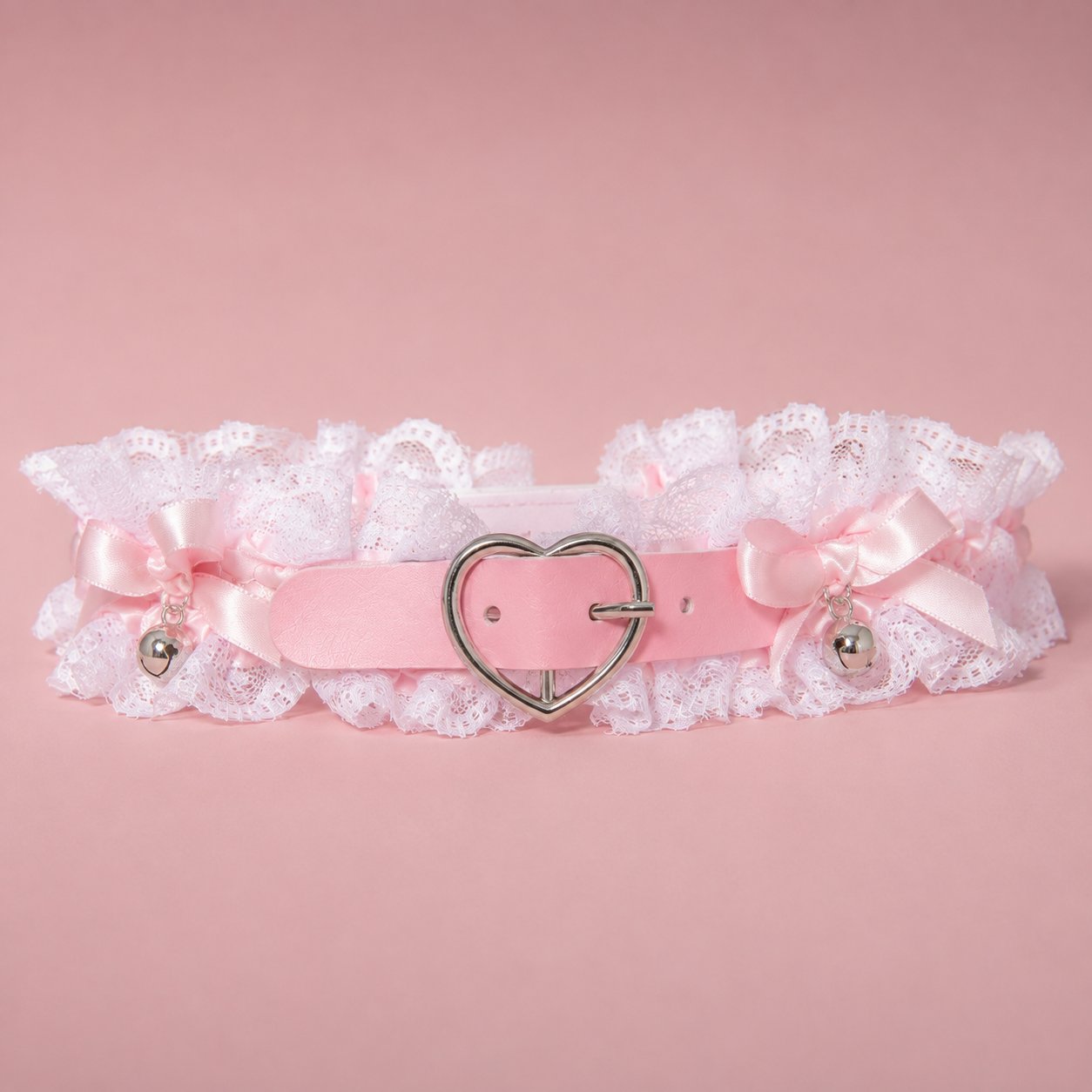 Close up of heart buckle and bells on angel clouds lace choker