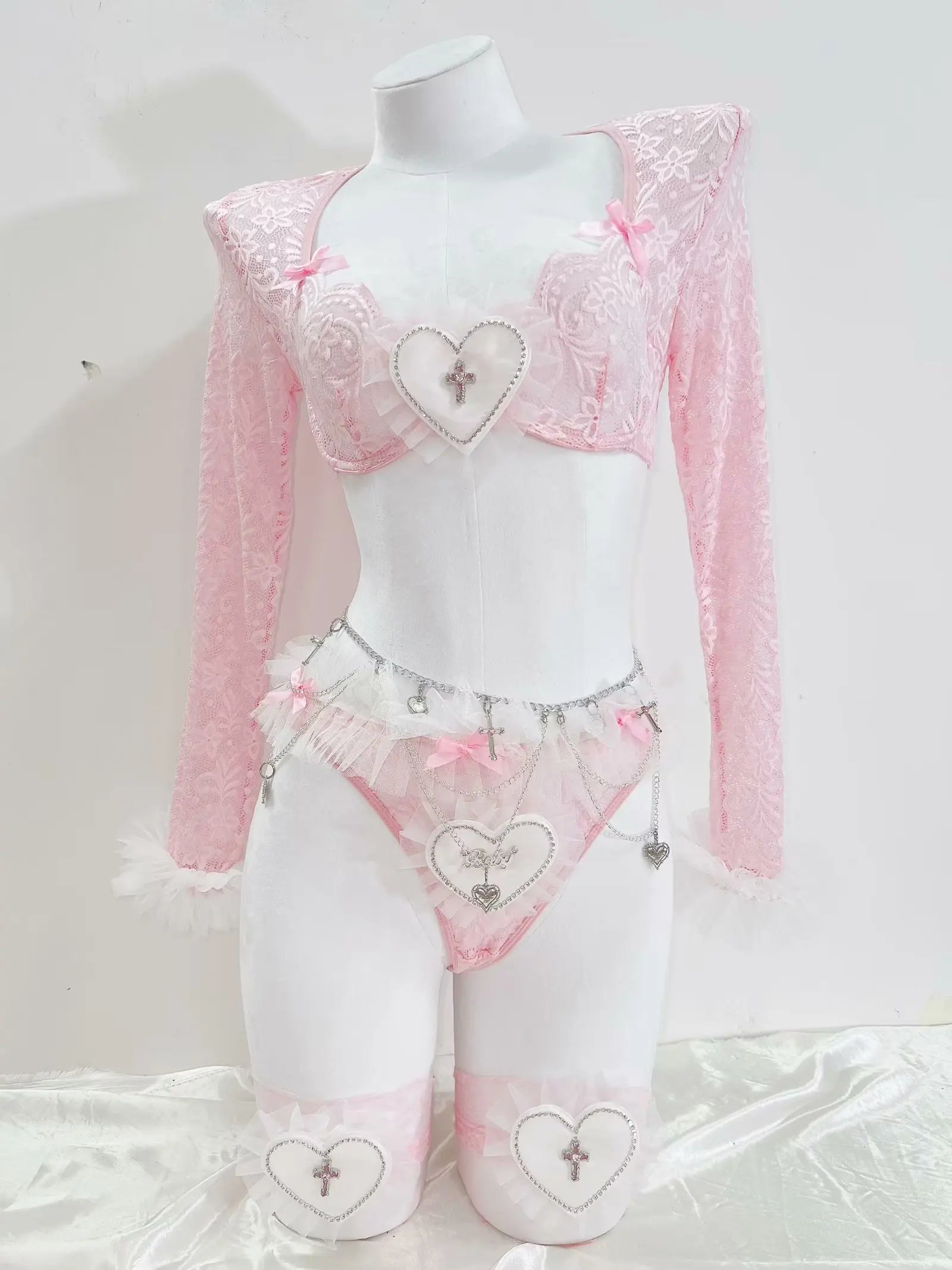Cropped lace bolero with fluffy white trimmed cuffs on pink angel heart coquette set