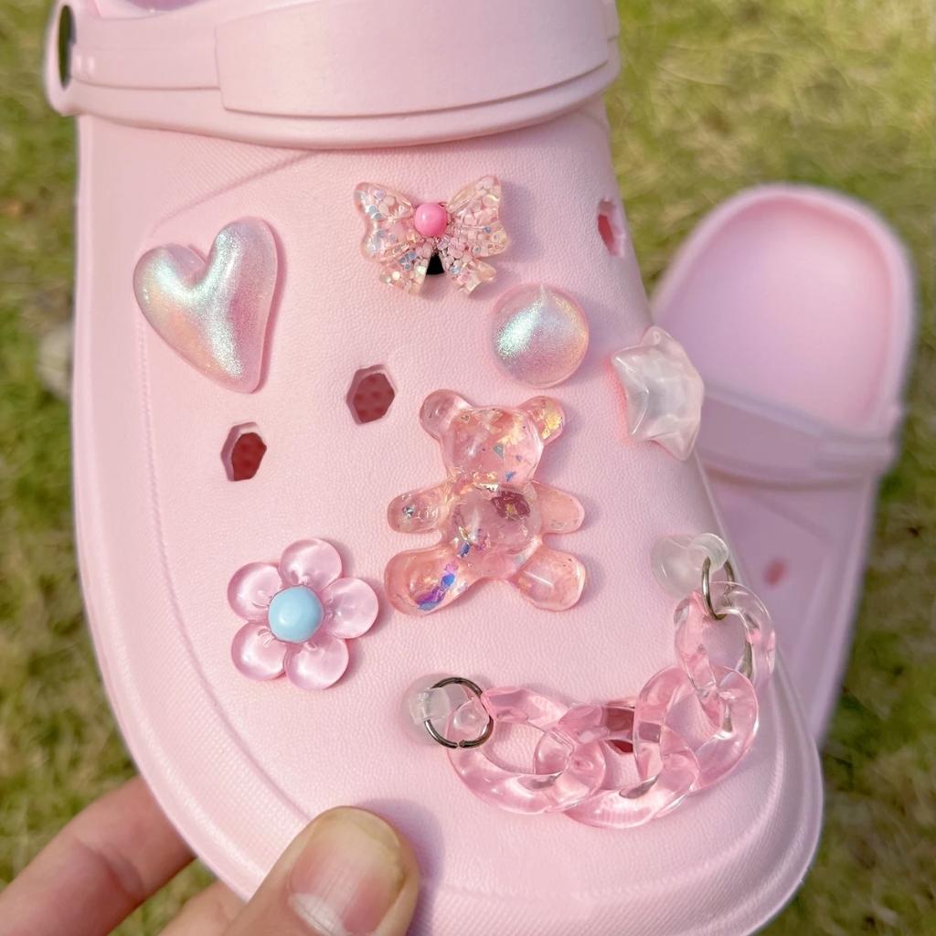 Pink pastel crystal wonderland shoe charm set flat lay 14 pieces ABDL little space cutecore kawaii