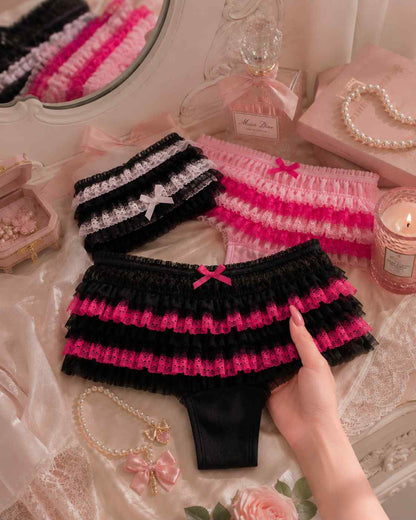 Model wearing pink ruffle Lolita panties with lace trim and bow, kawaii DDLGirl soft girl aesthetic