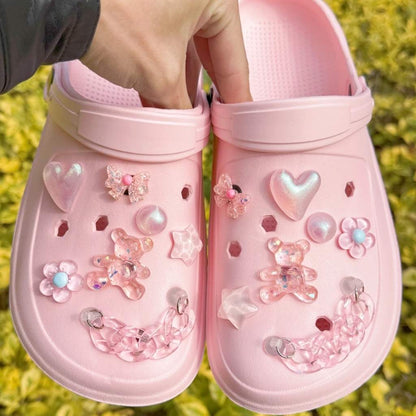 Pink shoe charm set with bears, hearts, and bows for customizing sneakers and sandals