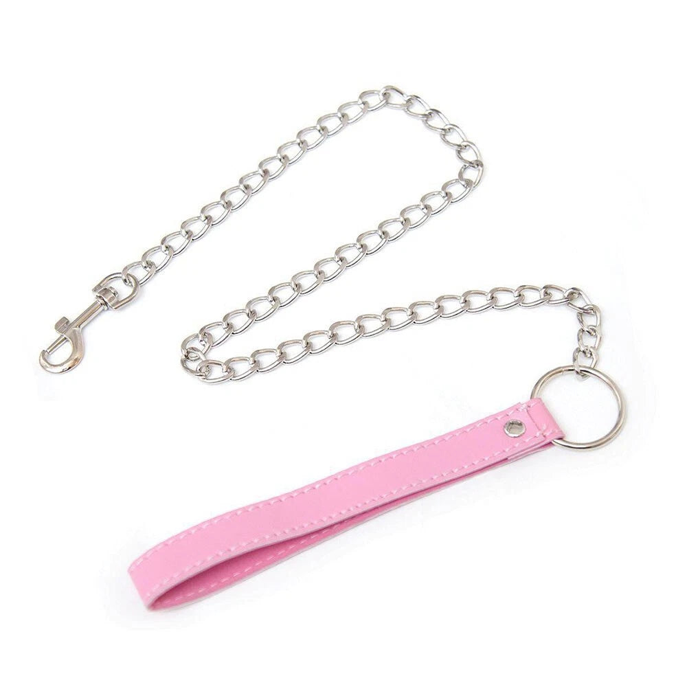 Flat lay of Pink Temptation Choker showing vegan leather, chain and bell for DDLG kawaii cutecore babygirl littlespace gifting