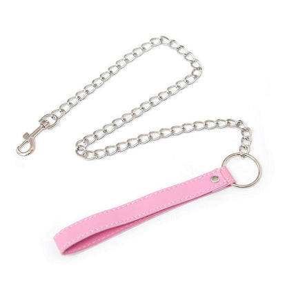 Flat lay of Pink Temptation Choker showing vegan leather, chain and bell for DDLG kawaii cutecore babygirl littlespace gifting