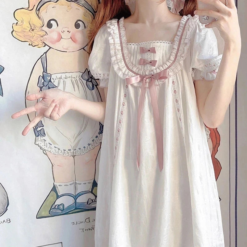 Close up of ruffled lace square neckline and pink accents on Lolita nightgown