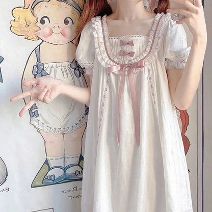 Close up of ruffled lace square neckline and pink accents on Lolita nightgown