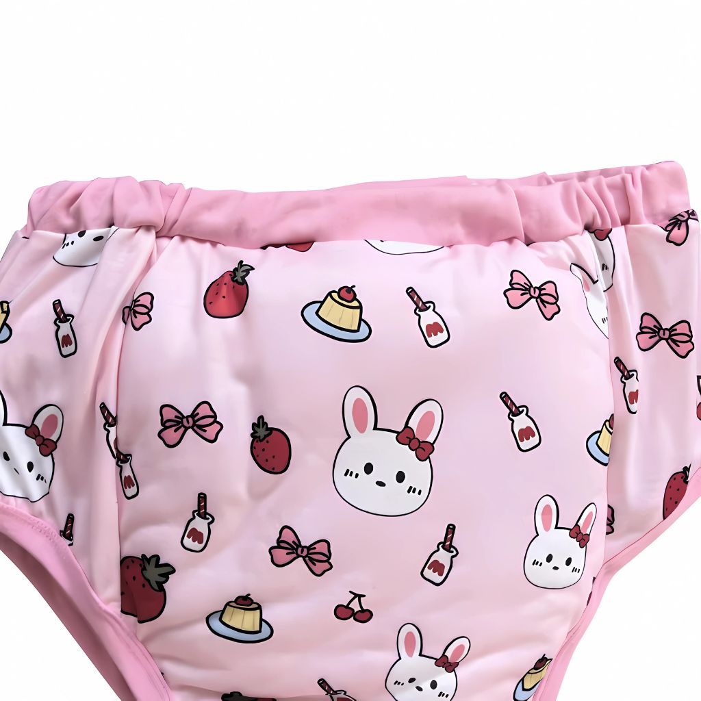 Reusable adult diaper cover in pastel pink with bunny and dessert pattern, perfect for age regression or ABDL lifestyle