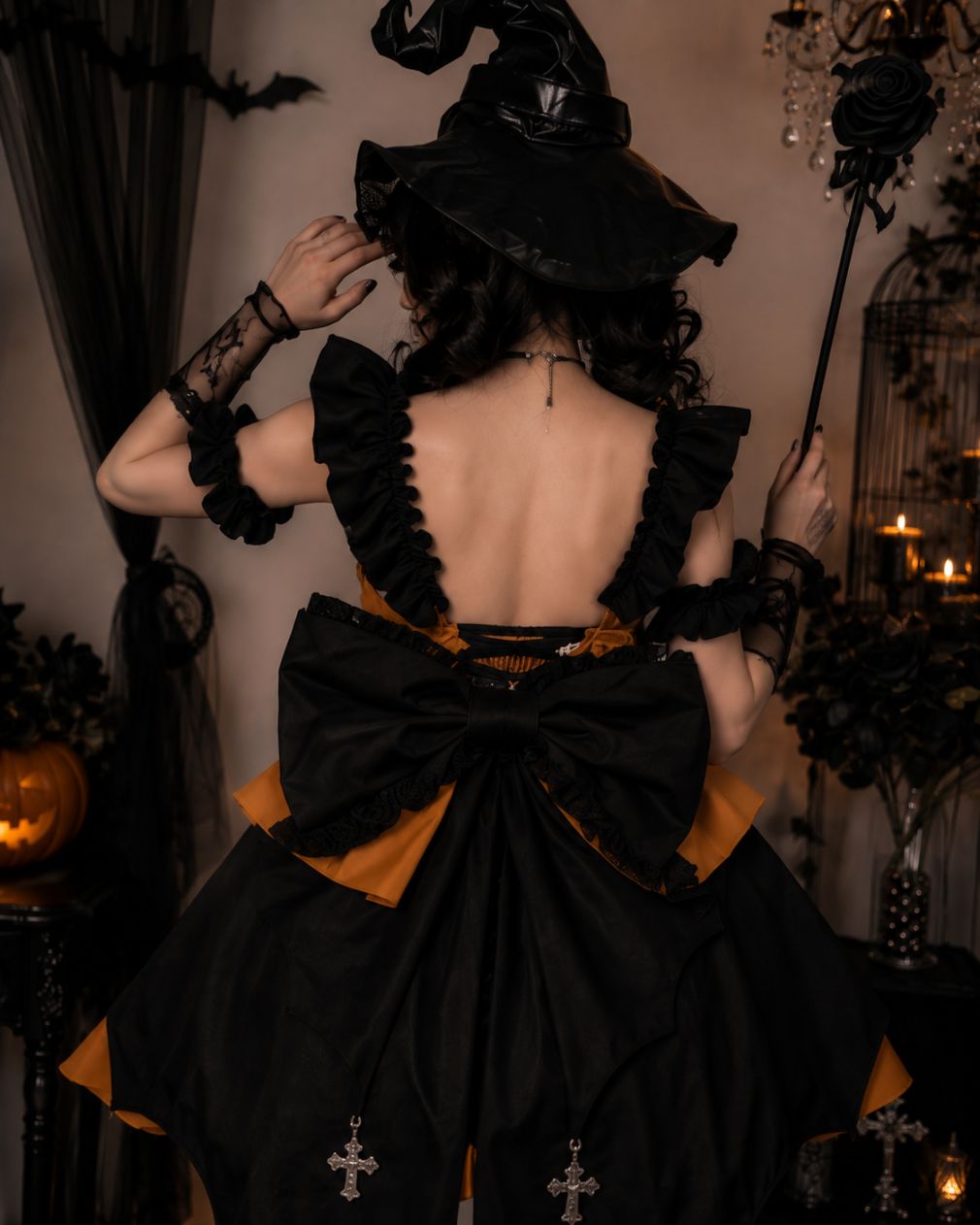 Oversized black waist bow detail on kawaii Gothic Lolita pumpkin dress, DDLG accent