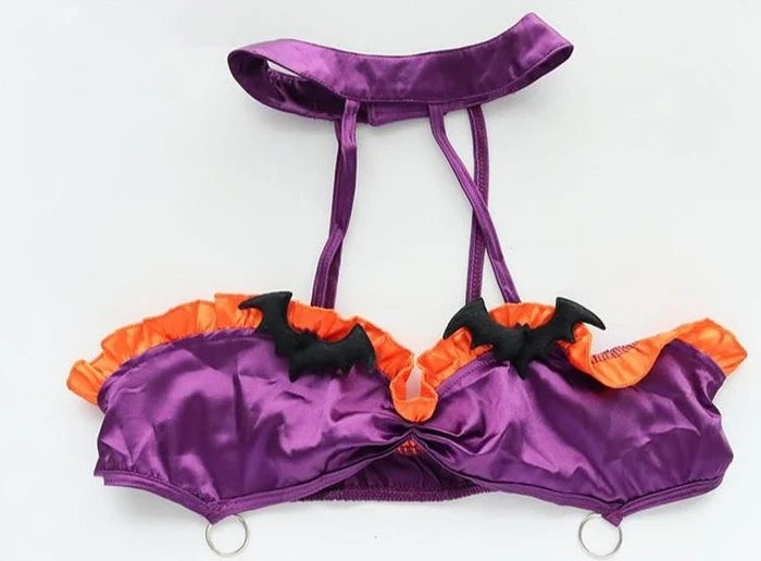 Flat lay of Purple Batty Babe ruffle Halloween set with choker
