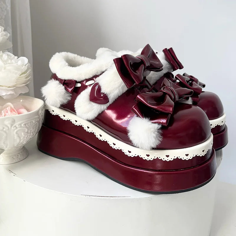 Vibrant red Pom Pom Angel Baby Platform Shoes with elegant ribbons and fluffy pom poms for kawaii fashion lovers