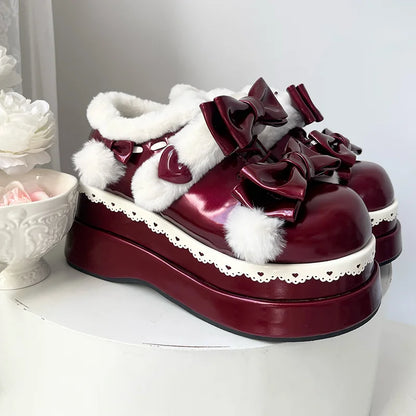 Vibrant red Pom Pom Angel Baby Platform Shoes with elegant ribbons and fluffy pom poms for kawaii fashion lovers