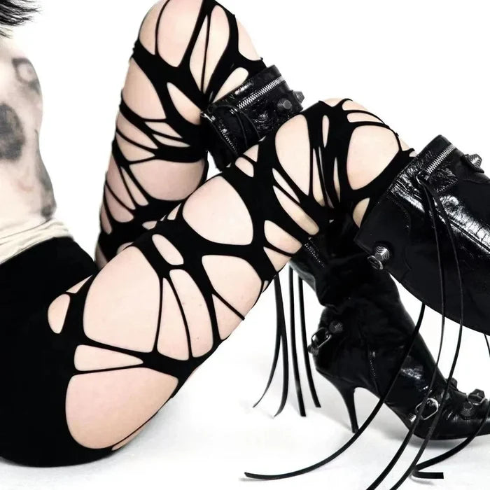 Ripped web alternative tights styled for cyberpunk scene and Y2K fashion looks