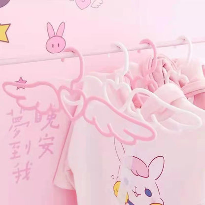 Romantic closet hanger with delicate wings and heart centerpiece for DDLG ABDL lovers