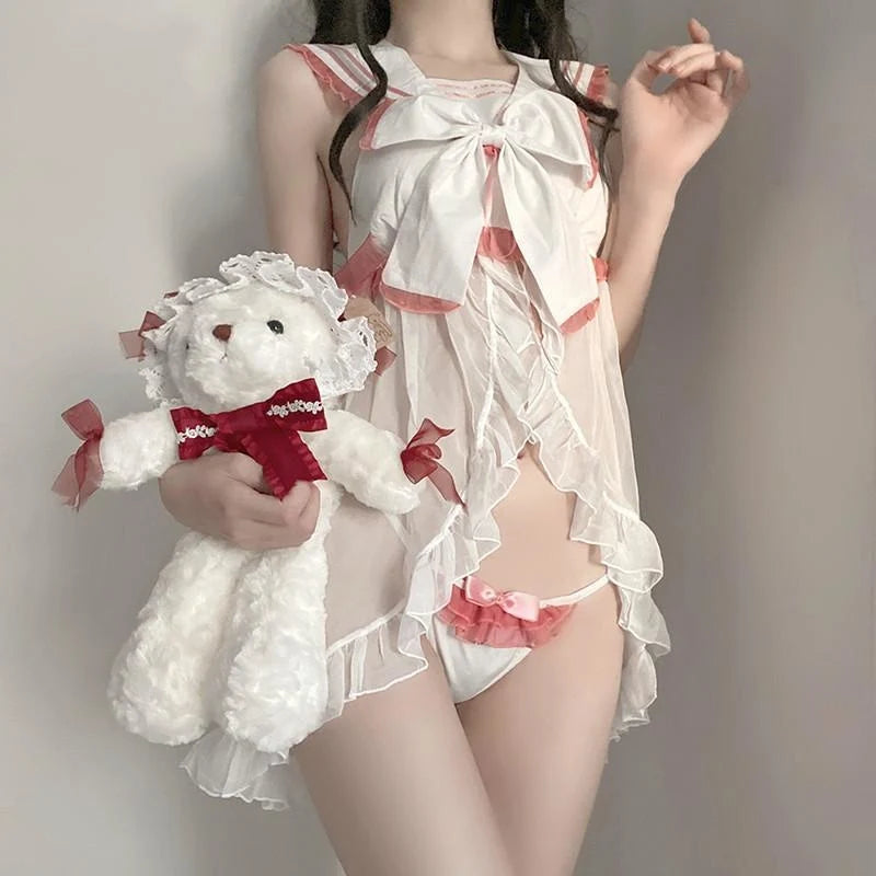 Oversized statement bow with flowing ribbon tails on babydoll set bodice