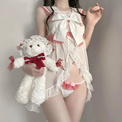 Oversized statement bow with flowing ribbon tails on babydoll set bodice