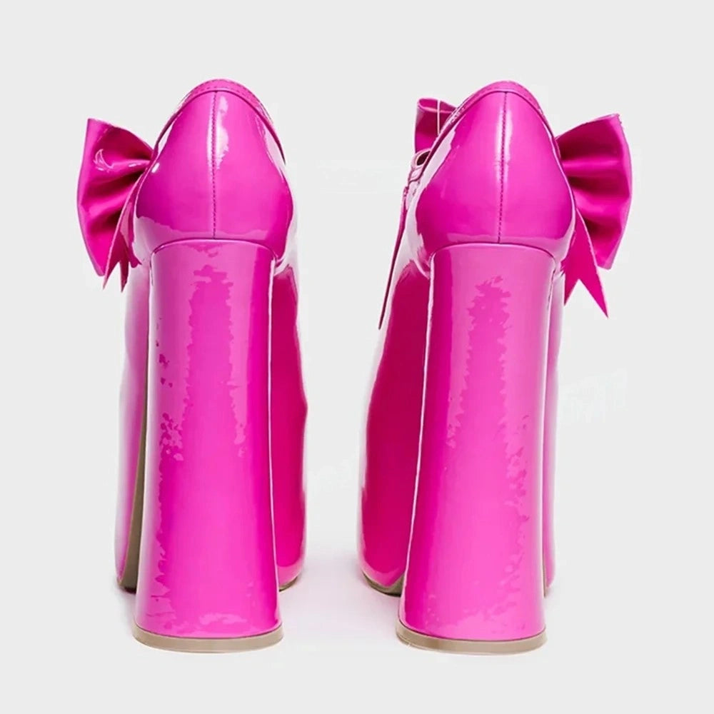 Sexy kawaii glossy pink platform heels with bows, perfect for DDLG and soft girl aesthetics