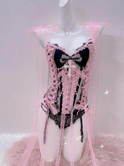 Sexy soft pink lingerie set with sheer fabric, bold cross detail, and curve-hugging comfort.