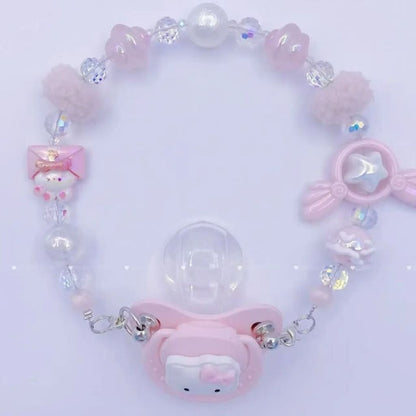 Magic Glow silicone pacifier with cozy wings and star accents for soothing little ones day and night.