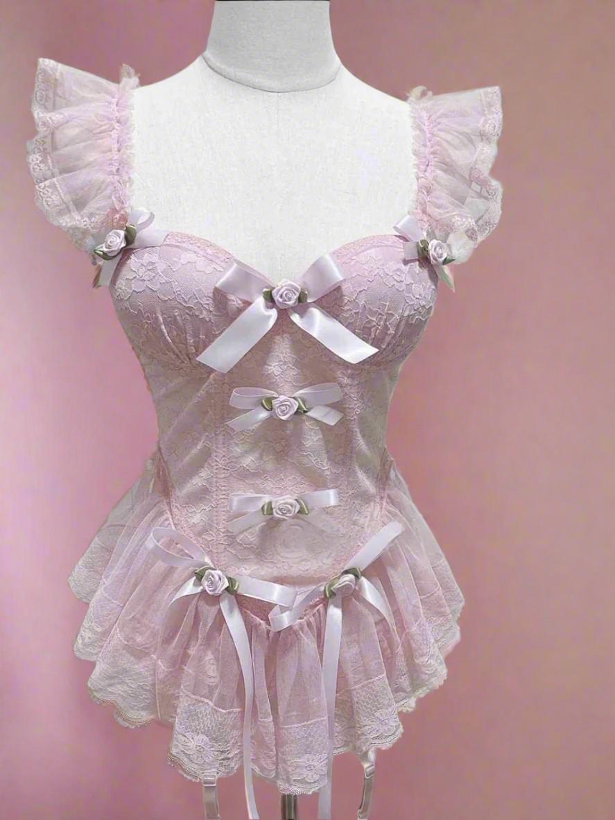 Soft babydoll style corset in pastel pink with pearls, roses, and ruffles for cute DDLG fashion